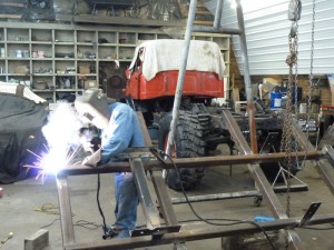 Tim welding up a new sub-frame for the Mog